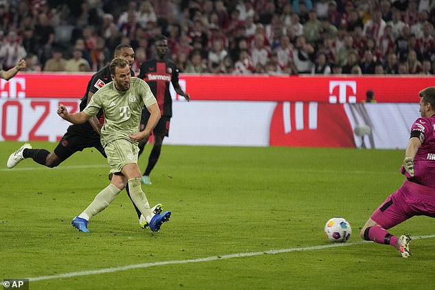 Kane (left) has been in productive form for his new club, scoring in four of his first five league matches