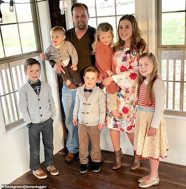 Josh pictured himself with his wife Anna and five of their seven children before his sentencing