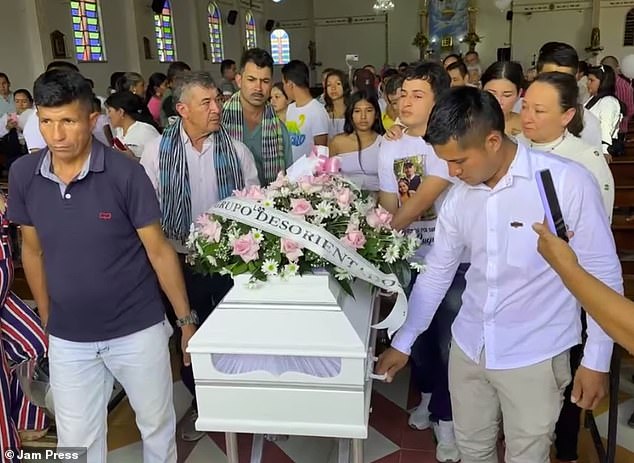 Family members carry the coffin containing the remains of Yerly Lozada, a 10-year-old influencer who died in an accident in Colombia on September 12