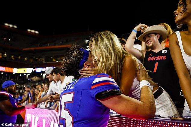 The two shared a kiss after Mertz and Florida defeated McNeese State at home on September 9