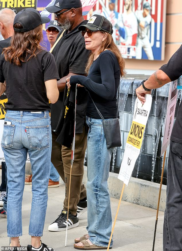 Comfortable: Katey stayed comfortable in a black long-sleeved top and light wash jeans