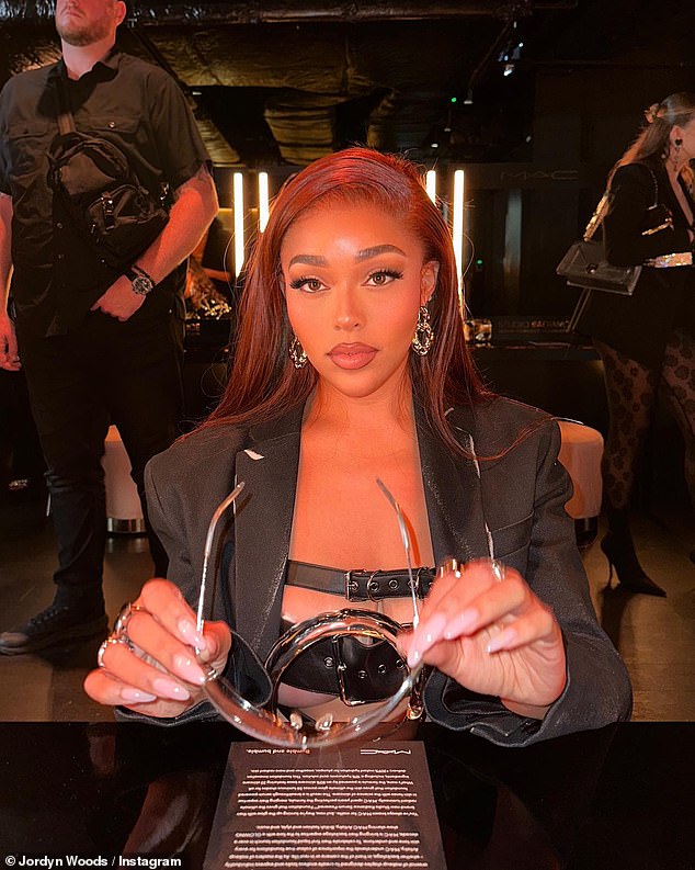 Long hair, it doesn't matter: Jordyn opened with some photos of herself sitting at a table at the MAC show.  Jordyn showed off her gorgeous white smile as she wore her straight red hair in a side part as her long locks cascaded down her shoulders