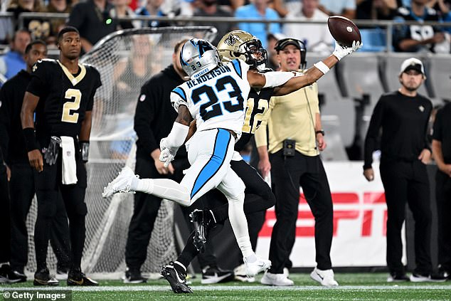 Olave extended his left arm as Panthers cornerback CJ Henderson piled on the pressure