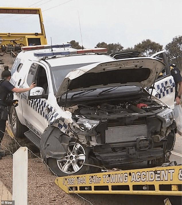 Two officers pursued Turvey but lost control of their vehicle on Creighton Road before it rolled and was partially crushed (photo)