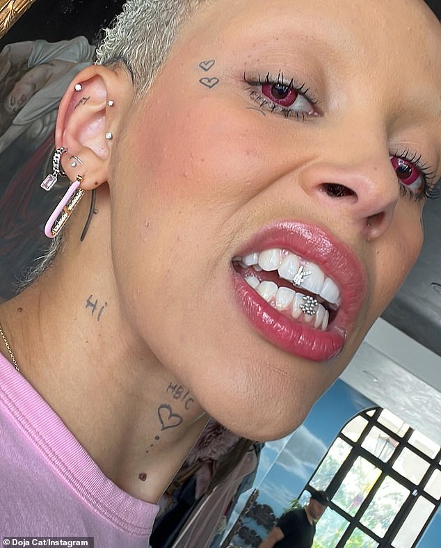 Ice: Last Friday, Doja Cat (born Amala Ratna Zandile Dlamini) wore the brand's $3K 'Playboy Grillz' on her upper teeth with a custom Chanel-shaped grille on her lower teeth