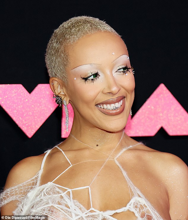 Smile!  And last Tuesday, Doja Cat grinned on the red carpet of the 2023 MTV Video Music Awards in New Jersey while wearing her custom 