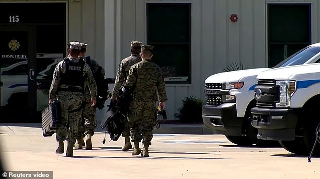 Search and rescue teams are pictured hunting for the plane on Monday