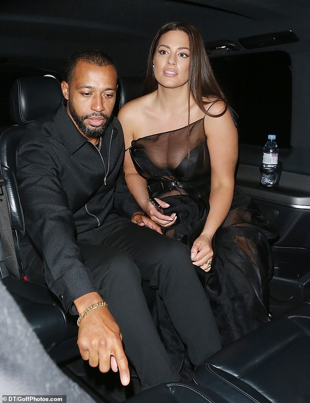 Sitting nicely: Ashley and her husband sat happily together in the car on the way home