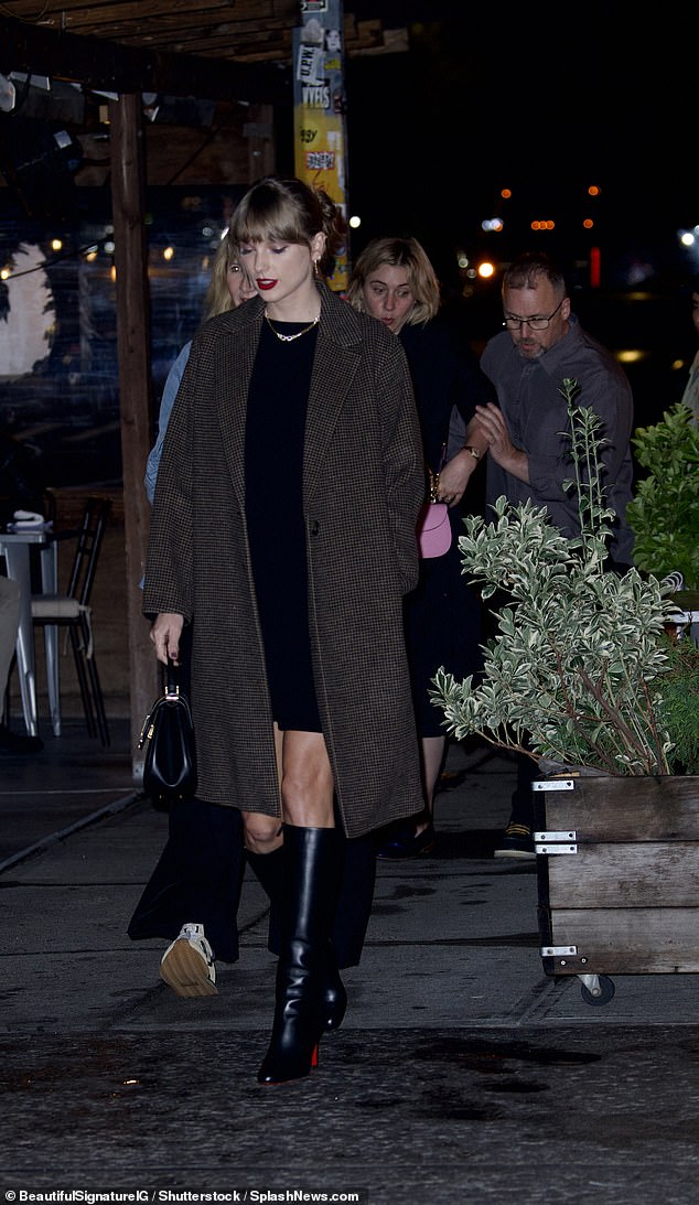 Dinner outfit: Gerwig wore a flowing black dress with matching loafers.  She paired the look with a stylish light pink crossbody bag from Gucci