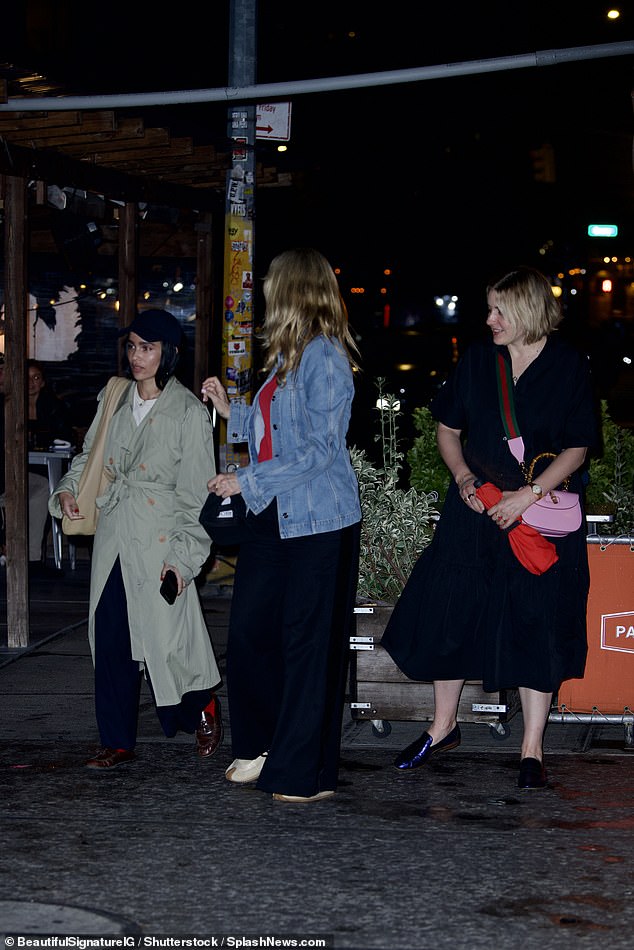 Comfortable: The daughter of rock star Lenny Kravitz wore a navy blue baseball hat over her black locks and carried a large cream tote bag on her shoulder