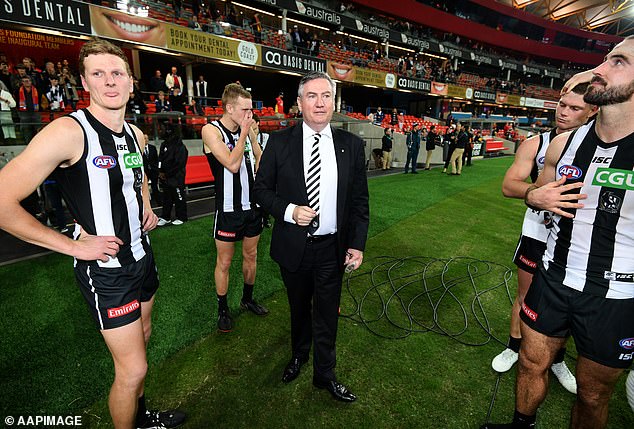 'Eddie Everywhere' (pictured with Collingwood players after a 2018 match) doesn't think the AFL is homophobic in any way - and believes real change in the way gay players are treated will be driven by forces outside the league