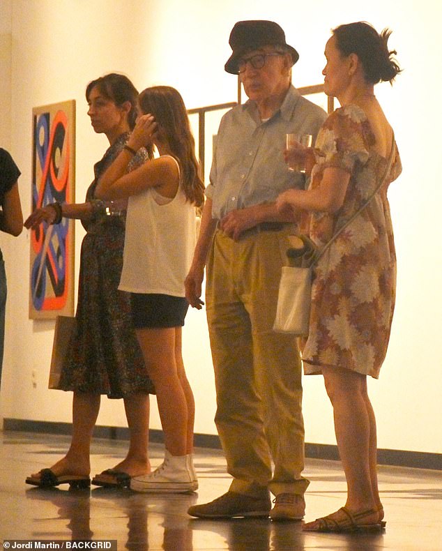 Don't mind us: Allen and Previn mingled with other visitors Monday as they made their way through the Catalan gallery