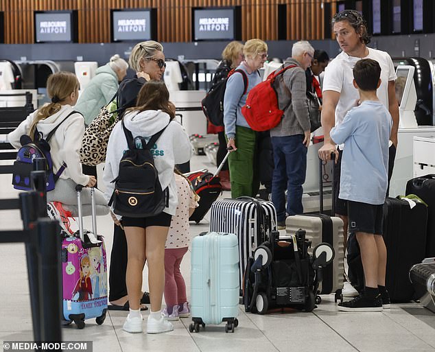 Fifi and Rocky, along with their mixed brood, were all smiles as they checked in at the airport