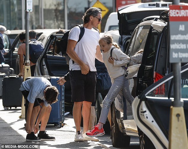 The children excitedly got out of the taxi and prepared to go to the terminal