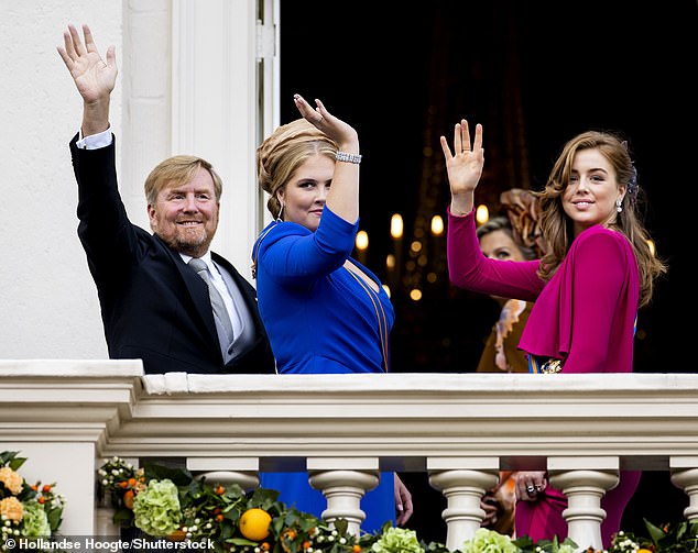 The family paused to wave one more time before heading inside Tuesday afternoon