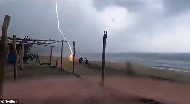 Lightning strikes a woman on a beach in Mexico just seconds before a man near her was also shocked.  Both individuals were confirmed dead