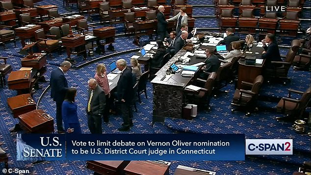 Republican Sen. Lisa Murkowski - visiting from Alaska - wore black pants, running shoes and a pink sports shirt during Monday night's votes.