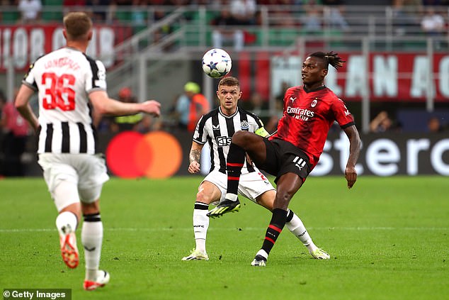 Newcastle defender Kieran Trippier keeps a close eye on Milan striker Rafael Leao.