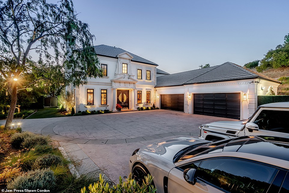 Paul's Porsche Panamera and Mercedes-Benz G-Wagen are pictured in the property's grand driveway.