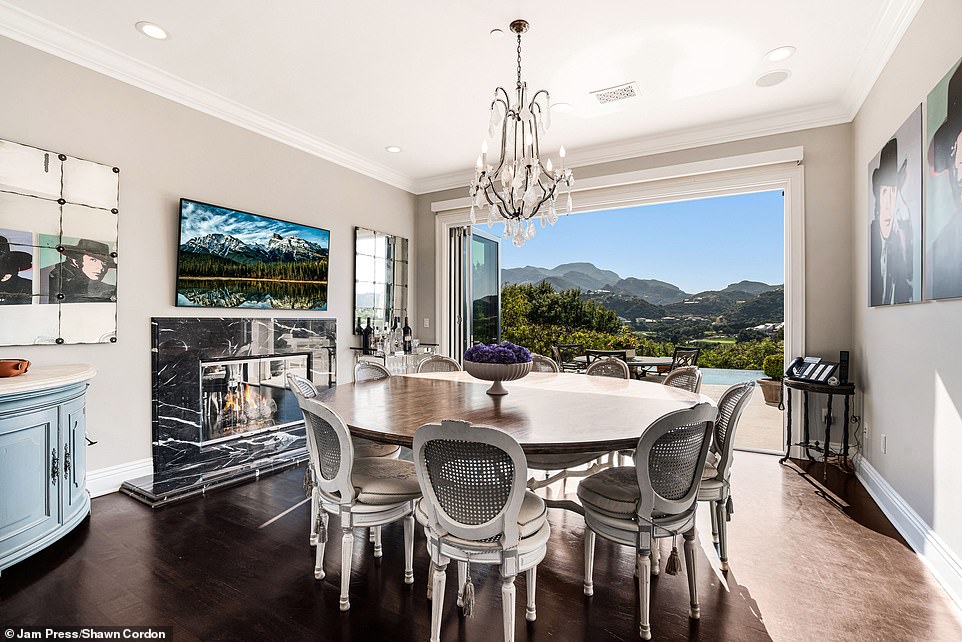 Formal dining space opens to fresh air and mountain views