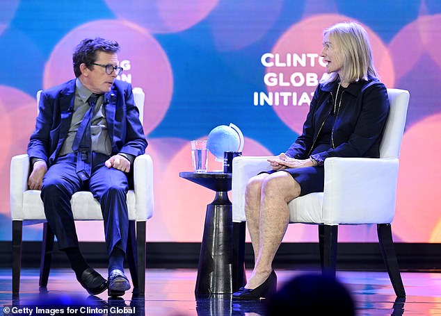 Fox was photographed on stage with his foundation's CEO, Deborah Brooks, at the event.