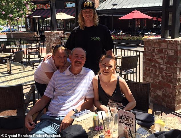 Andreas Probst (pictured surrounded by his family) was fatally struck by a teenage driver during an intentional hit-and-run in Las Vegas on August 14.  The driver and his accomplice in the passenger seat who took sick video of the murder have both now been charged with murder