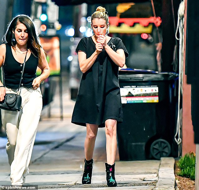 Elegant and casual: the beauty wore a short-sleeved black dress whose hem stopped just above her knees.