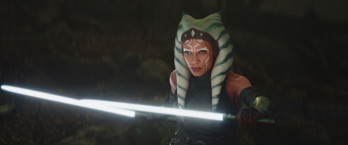 Rosario Dawson as Ahsoka Tano in The Mandalorian holding two white lightsabers