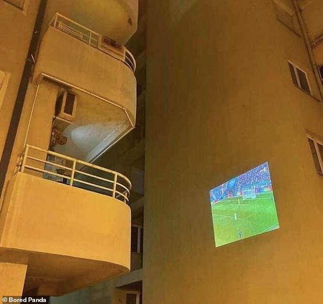 While some people used the building opposite to screen a football match and watch it from their balcony.