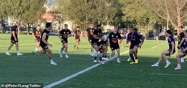 George Jennings (with ball) and his fellow Storm reserve players wore Panthers kit as they took on the team's front-row players in an opposing session.