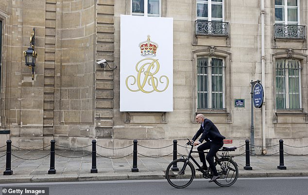 A cyclist passes the British Embassy on the eve of the visit of the King and Queen of England on September 19, 2023 in Paris, France