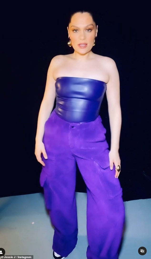 She looks good: Another saw her donning a purple leather strapless top and matching baggy pants.