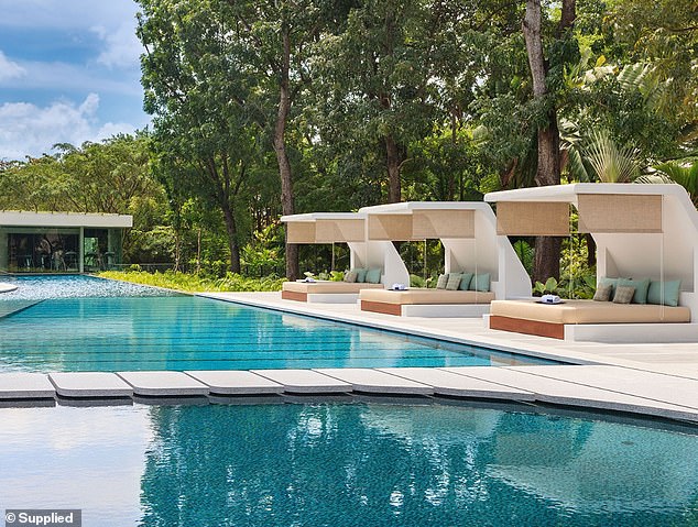 The exclusive resort has shared amenities including a large pool and cabanas