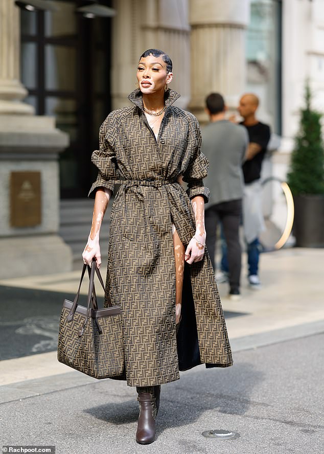 Ready and eager: Meanwhile, Winnie Harlow, 29, stepped out in head-to-toe Fendi, sporting a long trench coat emblazoned with the brand's logo.