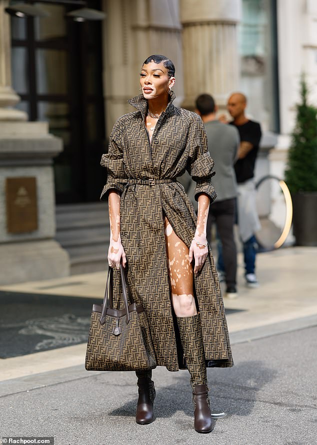 Leggy display: She added a matching belt to cinch it at her petite waist and wore nothing underneath to show off her long legs