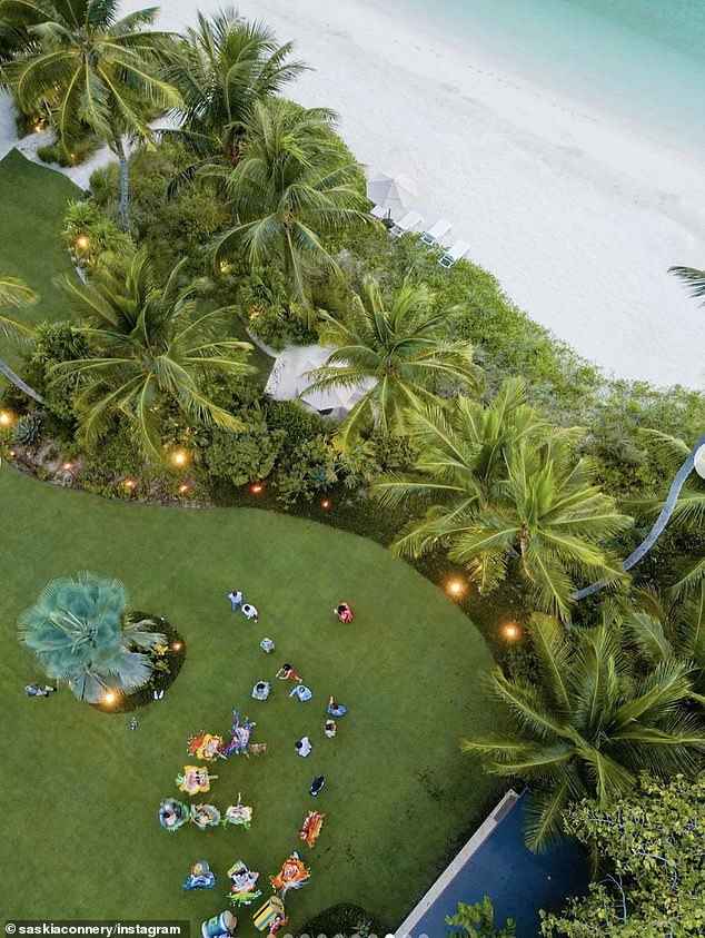 An aerial photo shared by Saskia shows the idyllic white sand beaches of the Bahamas, as well as dancing musicians.