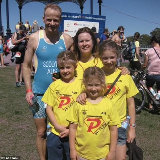 Dr Scolyer says he has plenty to live for with his wife Katie (pictured center right) and three children