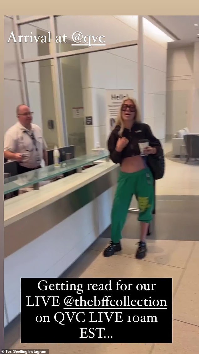 Tori is in the building: she wore a black top and green sweatpants with black shoes.