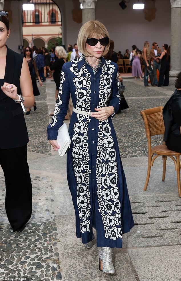 Amazing: Anna Wintour cut a very elegant figure in a navy and white patterned maxi shirt dress that she cinched at the waist with a white leather belt.