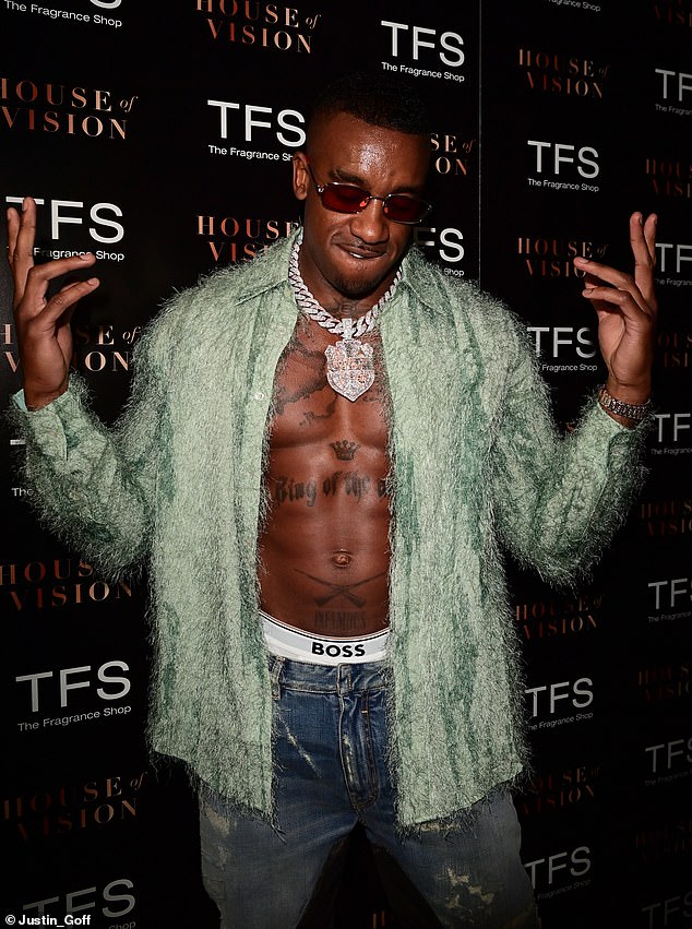 Flash: The rapper showed off his Boss underwear and beamed for the cameras at his launch event