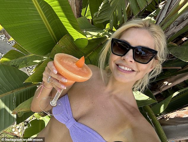 It looks good: she shared several snaps of herself soaking up the sun in a bikini, while shielding her eyes behind sunglasses.