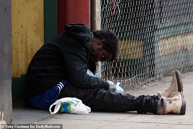 Another homeless man is seen here in the city's Ballard neighborhood, which faces a high crime rate.