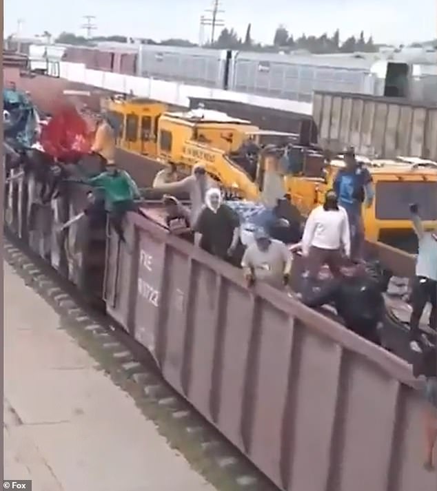 A freight train filled to capacity with migrants has been filmed as it speeds towards the Mexican border with the United States.