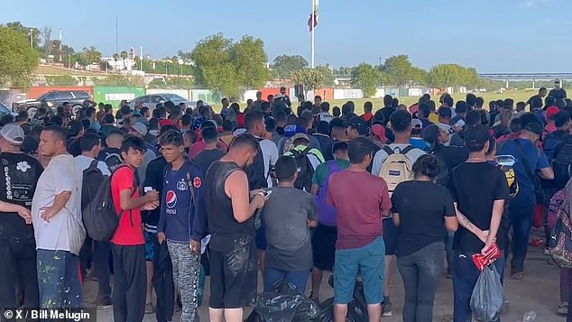 According to a Texas Department of Public Safety source, a large caravan of migrants has crossed the Rio Grande and thousands of people are now held under the Eagle Pass Bridge, with more believed to be on the way.