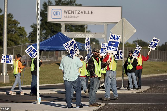 General Motors workers demonstrate outside the Wentzville, Mo., plant as the UAW union strikes against Detroit's Big Three automakers for the first time in history.