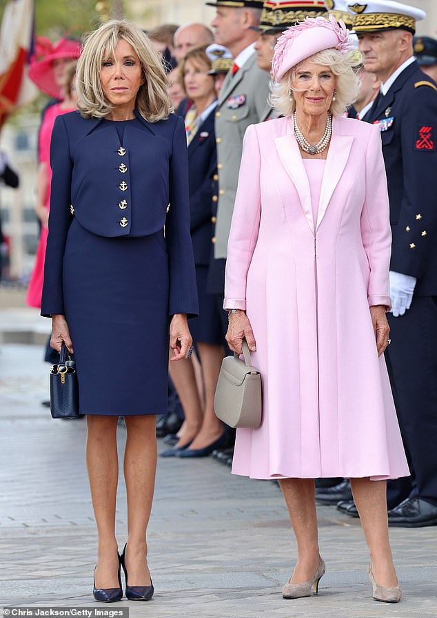 Camilla (right) wore a pink coat dress by Fiona Clare;  Brigitte wore a Saint Laurent suit