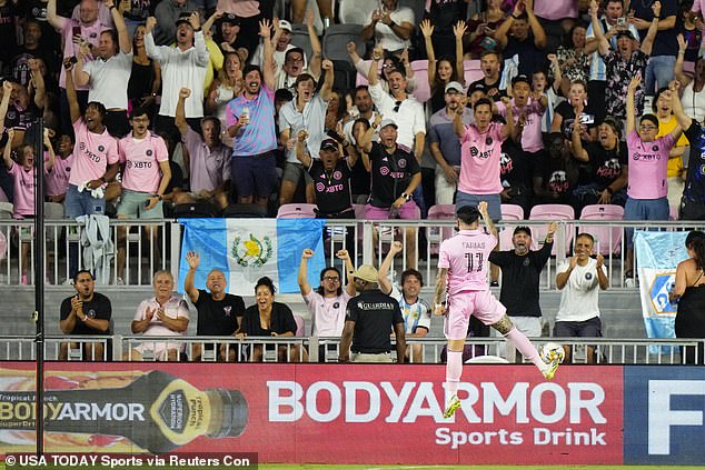 Inter Miami fans celebrate after witnessing the first goal of the evening scored at DRV PNK