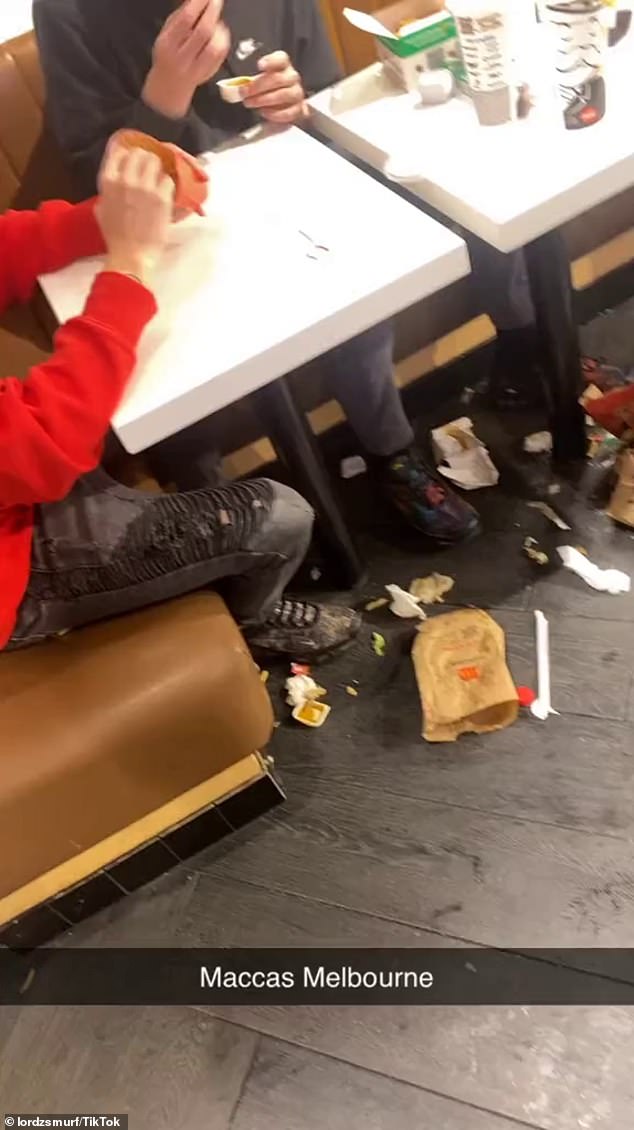 It showed a diner (pictured center) throwing his soda across the restaurant before it landed on the floor and spilled the liquid everywhere, near another group of diners