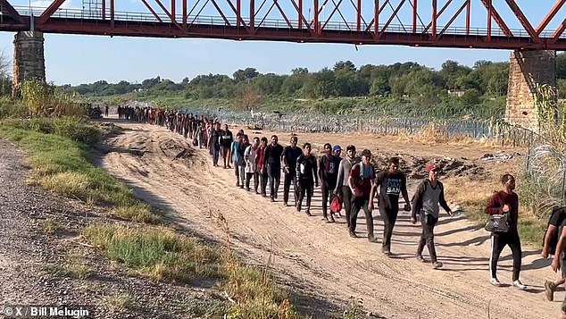 The line of migrants awaiting processing Wednesday stretched as far as the eye could see in Eagle Pass