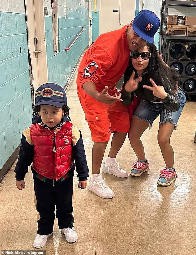 Grow up fast!  On September 30, Nicki (R, pictured on Monday) and her manager-turned-husband celebrate the third birthday of their son nicknamed 'Papa Bear' (L)